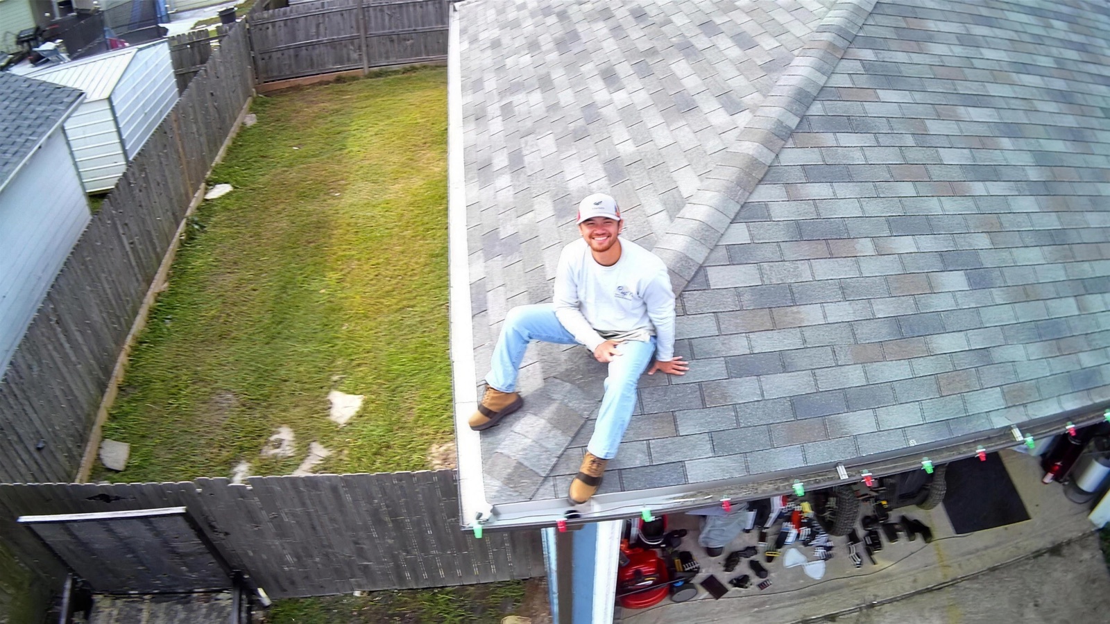 All American Pressure Washing owner on a freshly cleaned roof in Acadiana