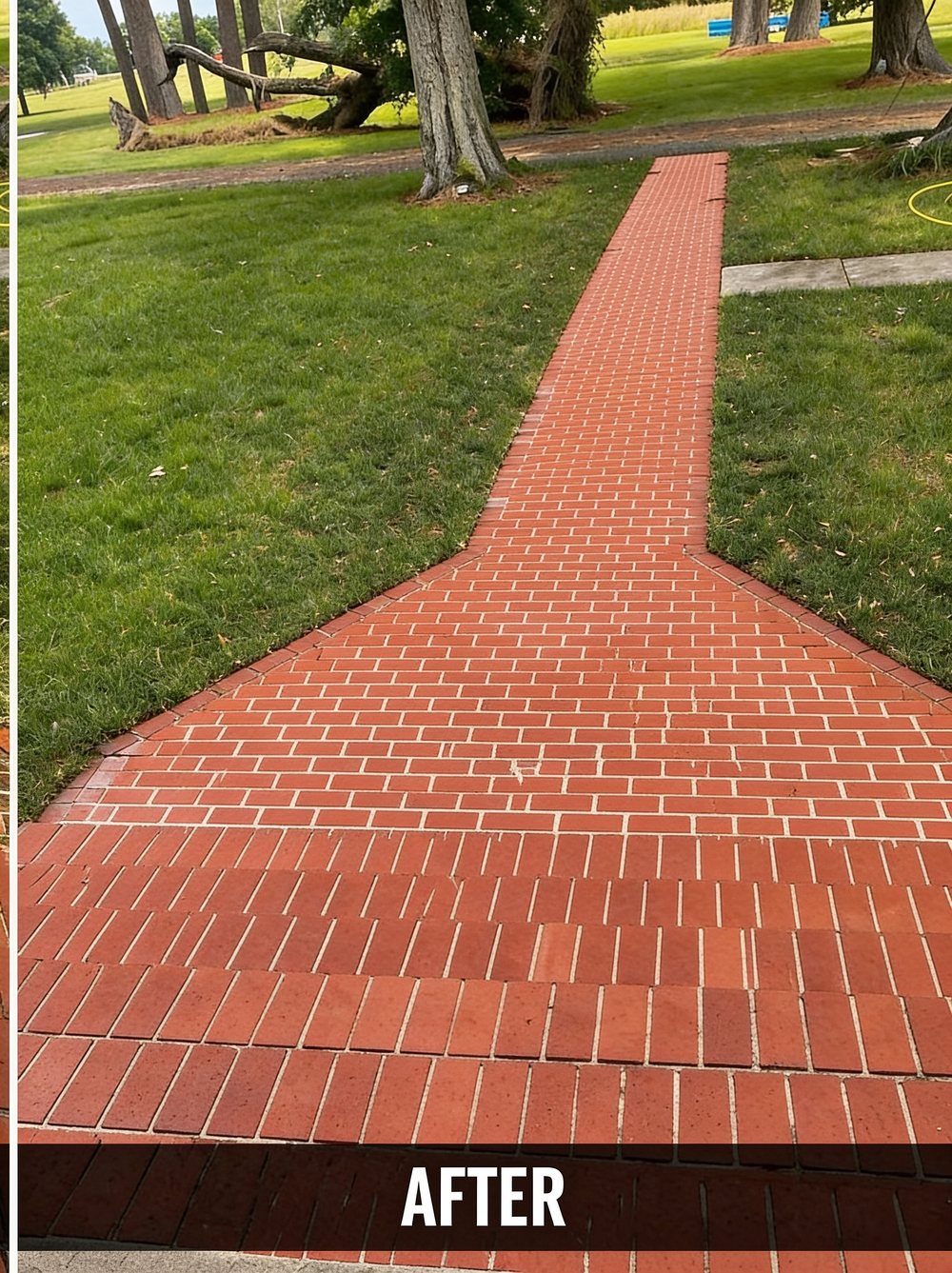 The same brick walkway after pressure washing, clean and bright red